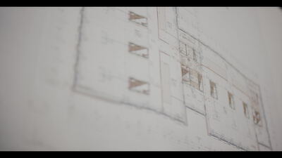 Architektonischer Grundriss auf Papier in weicher Unschärfe